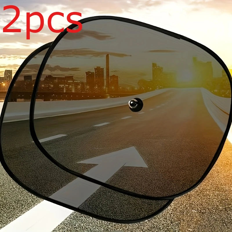 Two car sunshades are shown, one with an arrow pointing up on a road surface at sunset.