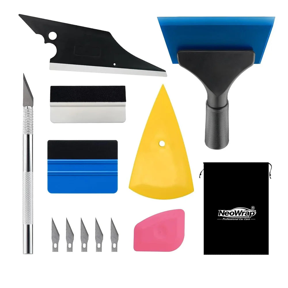 A kit for professional car window film installation including a blade, applicator, and various colored tools.