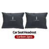 Two black Lincoln car seat headrest neck support pillows.