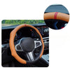 Close-up view of a brown leather steering wheel cover on a car interior.