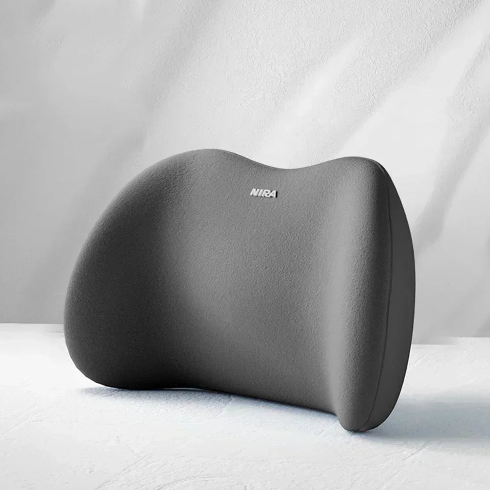 A gray ergonomic memory foam neck and lumbar pillow set resting on a white surface.