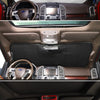 Interior view of a Ford F-150 showing various vehicle components and an aluminum foil windshield sunshade.
