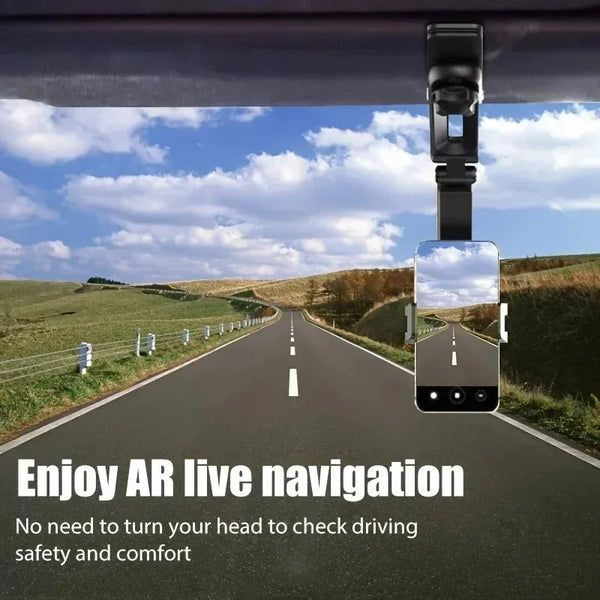 A phone holder is mounted to a car's rearview mirror, showing an augmented reality view of the road.