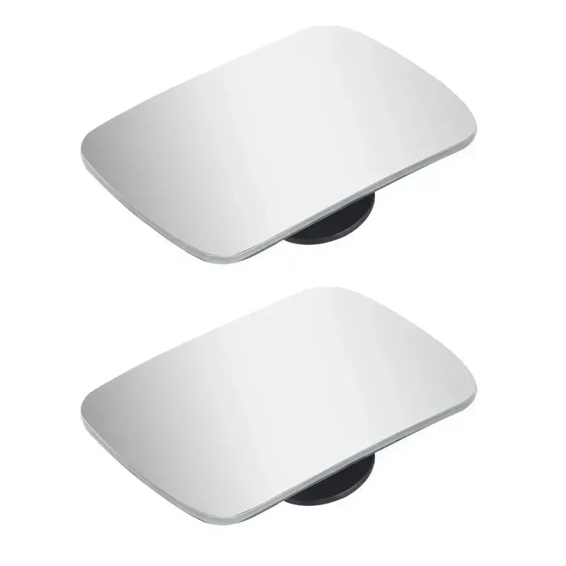 A white dual adjustable wide angle blind spot mirror for a vehicle.