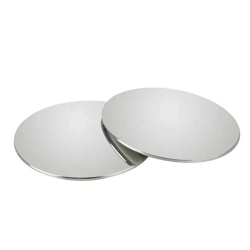 A circular, reflective rearview mirror used for car blind spot viewing.