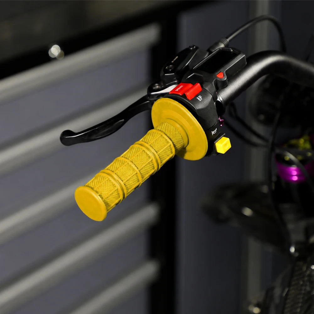 Close-up of a yellow silicone handle bar grip for a motorcycle, showing the textured grip and mounting mechanism.