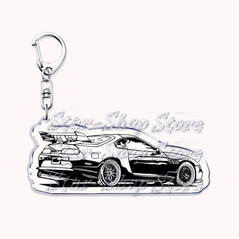 Silver acrylic keychain featuring a detailed black and white graphic of an off-road truck.