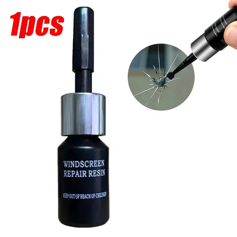 A black bottle of windscreen repair resin with a silver applicator tip shown next to a cracked glass surface.