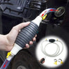 A hand is using a portable fuel and water transfer pump kit to transfer fluid from a vehicle component.