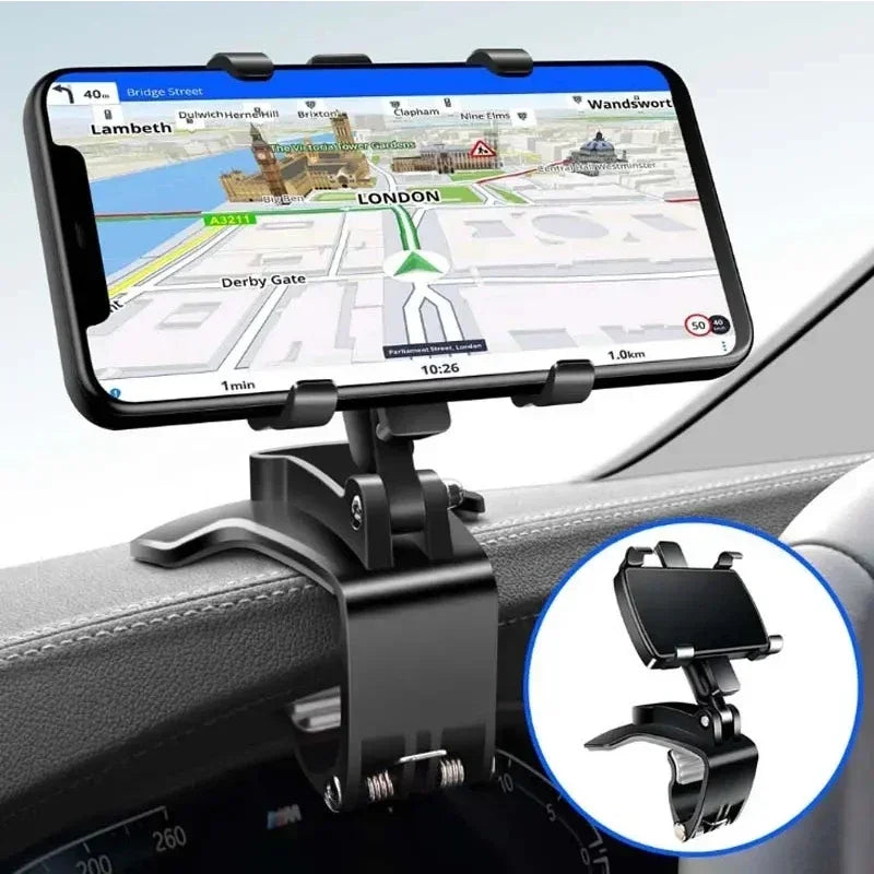 A black phone mount is installed on a car dashboard, holding a smartphone displaying a map.