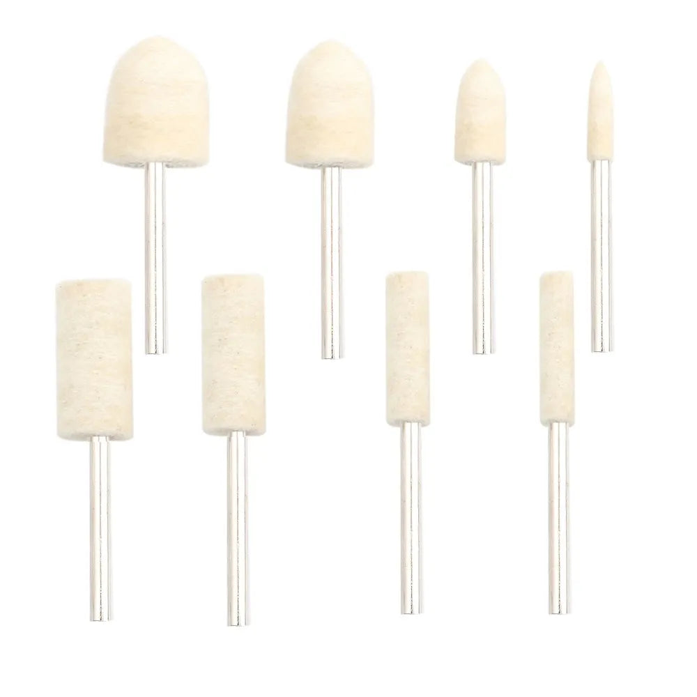 A set of light beige wool felt polishing buffing wheels with metal shafts.