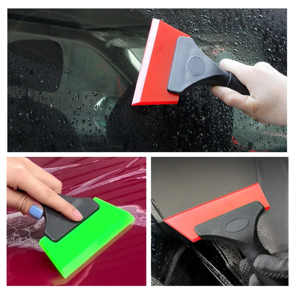A hand uses a heavy duty glass scraper with a red and black blade to clean a car window.