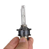 A hand holds a high-performance 35W Xenon HID bulb set with a glass tube and metal base.