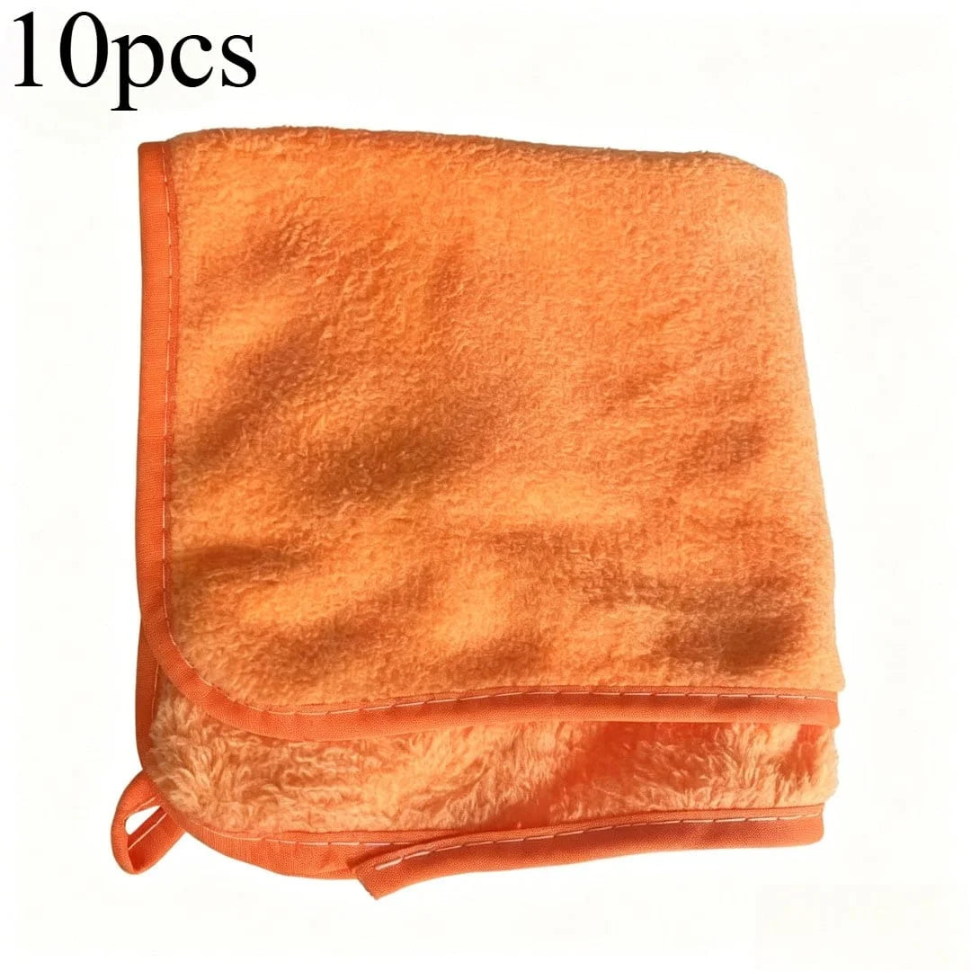 A set of ten orange microfiber car cleaning towels folded together.