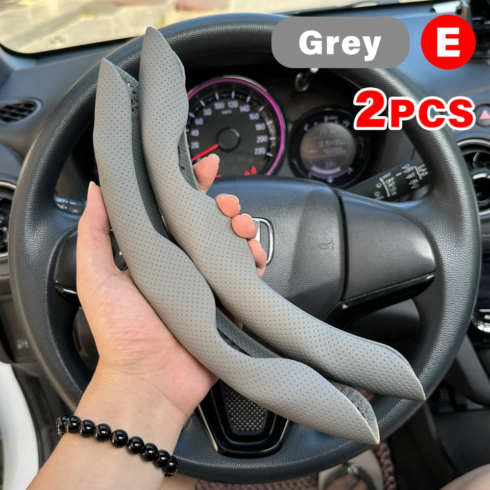 Grey universal car steering wheel booster cover with an 'E' logo shown on a car steering wheel.