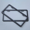 A black stainless steel car license plate frame set with a rectangular cutout design.