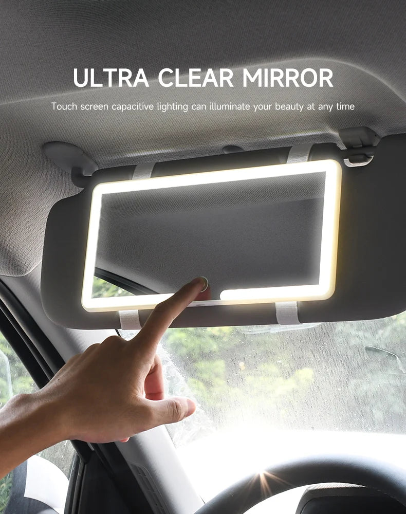 A hand touches an ultra clear mirror mounted on a car interior panel, illuminating the user's beauty.
