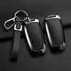 A black aluminum alloy key fob cover for a Ford vehicle, attached to a silver chain.