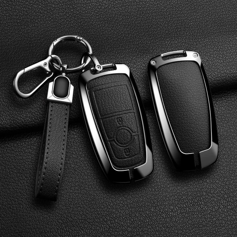A black aluminum alloy key fob cover for a Ford vehicle, attached to a silver chain.
