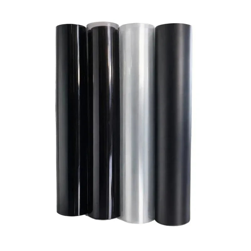 A set of four cylindrical tint films for car headlights and taillights in black and silver.