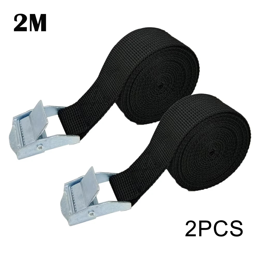 Two black heavy-duty cam buckle tie-down straps with silver alloy buckles.