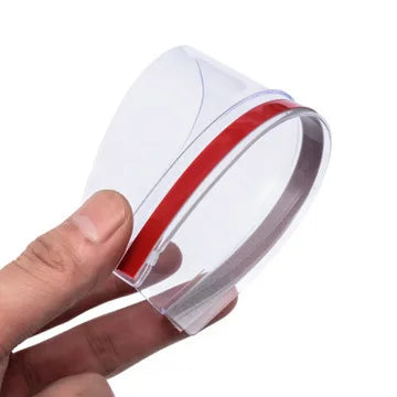 Clear plastic rain shield for a car rearview mirror, showing a red stripe detail.