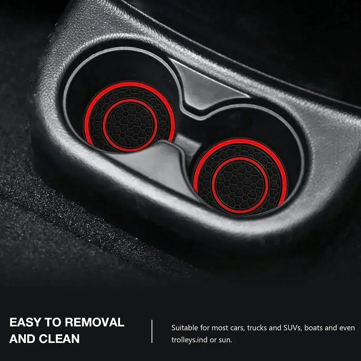 Close-up view of a black silicone car cup holder with two red patterned coasters inside.