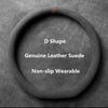 A circular black suede steering wheel cover with a D shape, designed to be non-slip and wearable.