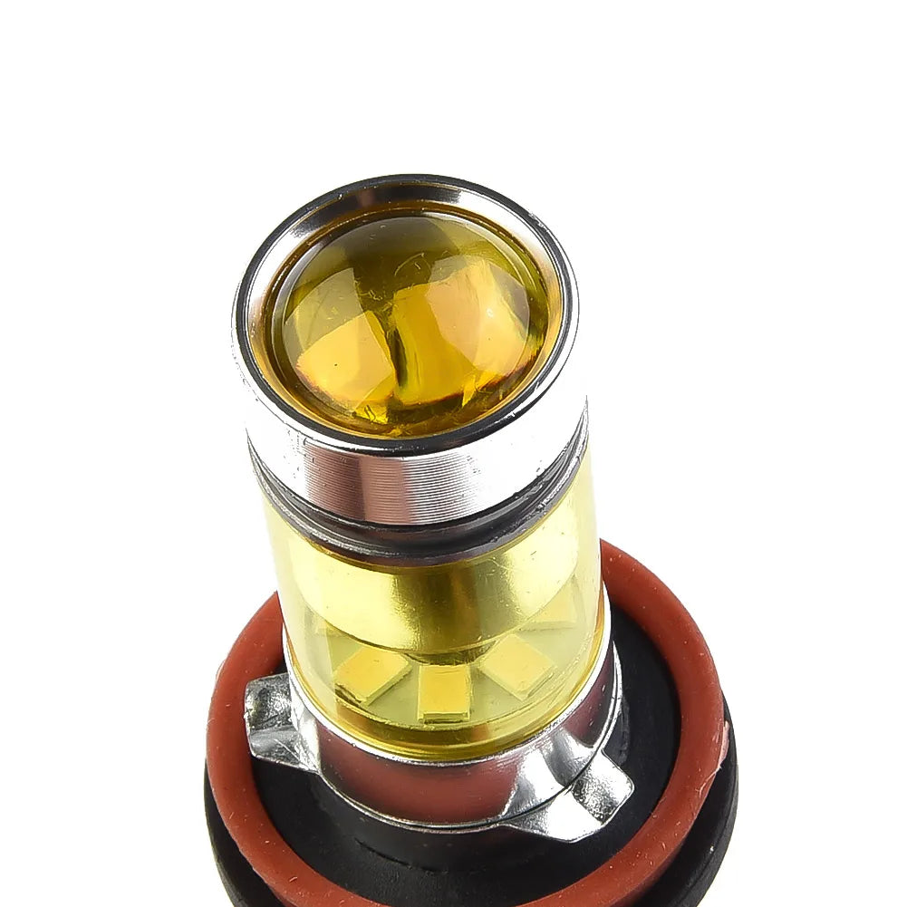 A close-up view of a yellow LED fog light bulb with a metal base and rubber seal.