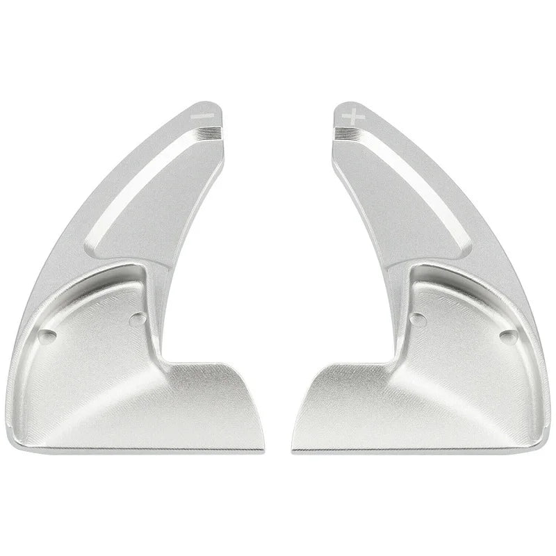 A pair of silver CNC aluminum steering wheel paddle shifters.