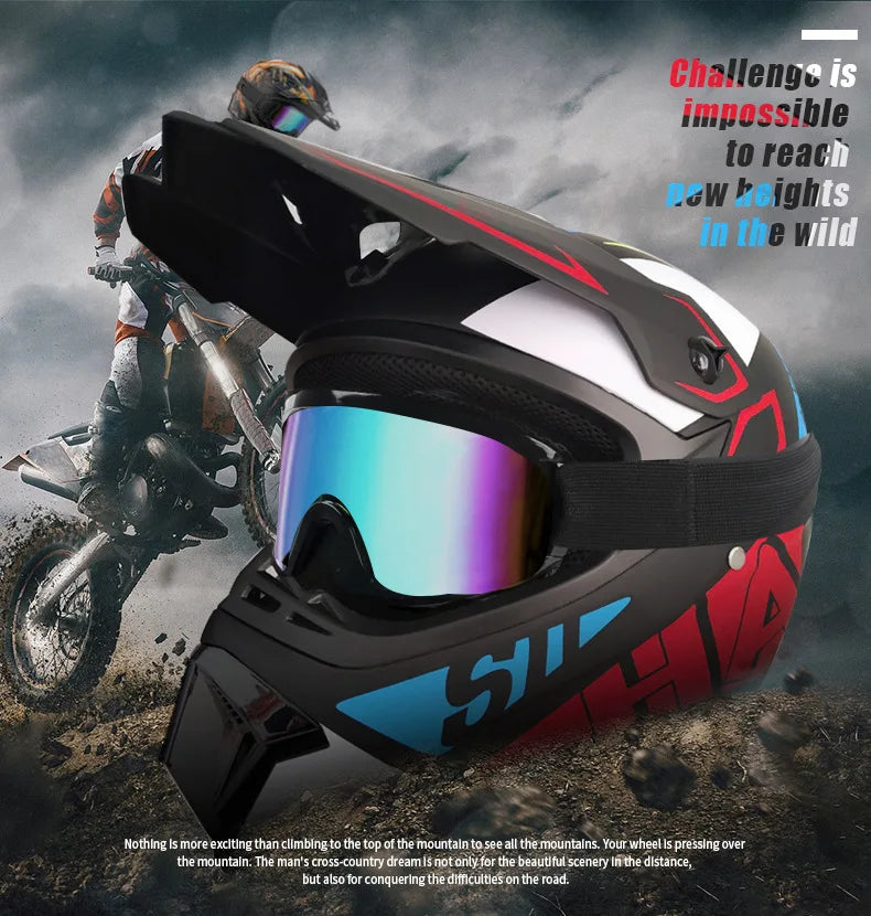A black and red off-road safety helmet is shown being worn by a rider on a motorcycle in a rugged outdoor setting.
