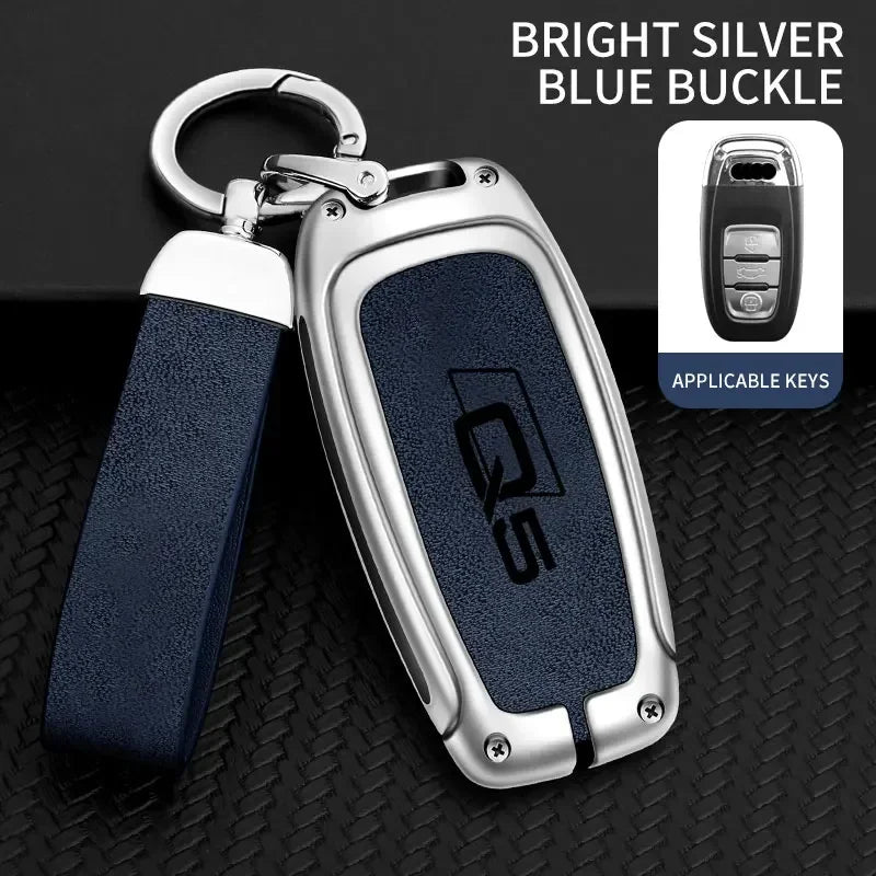 A bright silver blue buckle key fob cover for an Audi Q5, shown with a lanyard and close-up details.