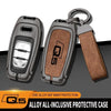A protective case for an Audi Q5 key fob made of zinc alloy with a textured brown grip.