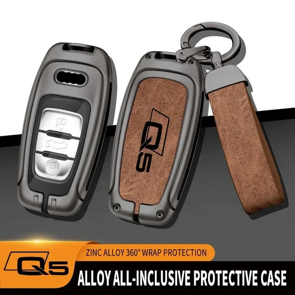 A protective case for an Audi Q5 key fob made of zinc alloy with a textured brown grip.