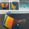 A motorcycle helmet visor lens showing various color tints and angles, including orange, yellow, blue, and clear.