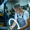 A man is using a multifunctional handheld light stick to illuminate an engine compartment.