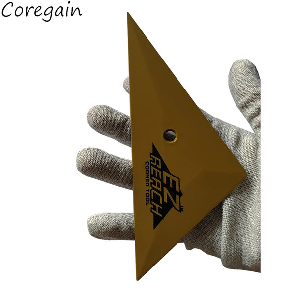 A hand holds a triangular silicone squeegee tool for window tinting or vinyl application.