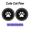 Two black cat paw shaped coasters with rhinestone borders