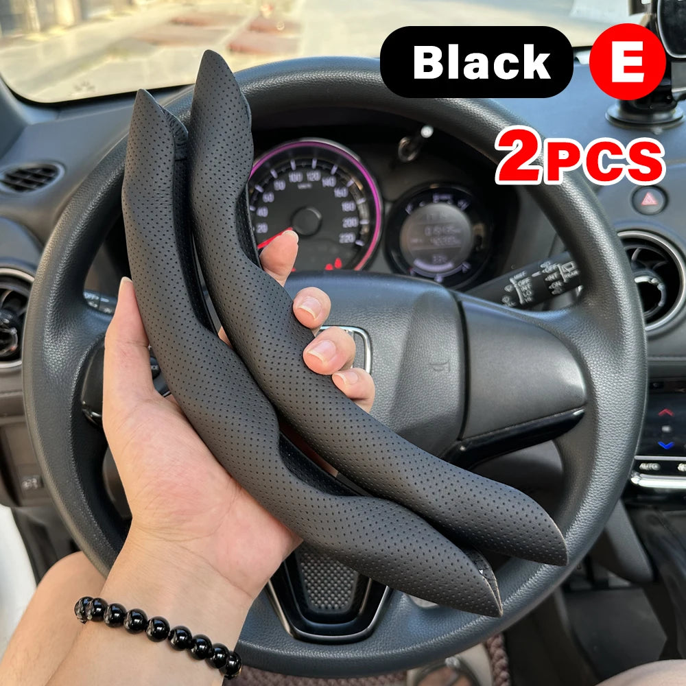 Black universal car steering wheel booster cover with an E-shaped design shown on a car steering wheel.