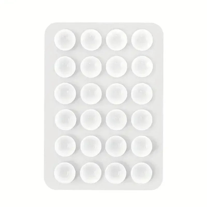 Support de téléphone en silicone avec plusieurs fixations circulaires pour montage mural.
