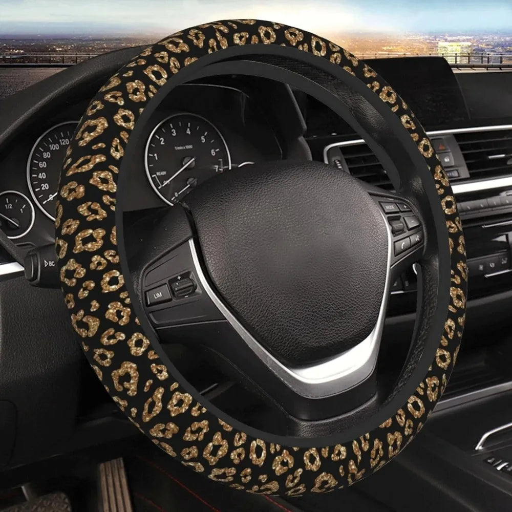A black steering wheel covered in a leopard cheetah print material inside a car