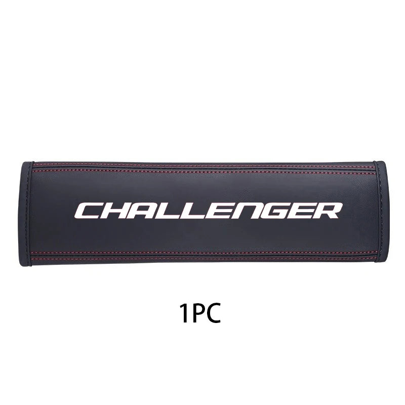 Black leather car seat belt shoulder strap pad with silver lettering