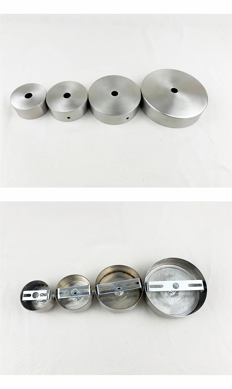 A row of five modern stainless steel pendant lamp fittings or caps.