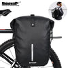 A black waterproof bike pannier bag is shown mounted on a bicycle frame.