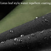 Close-up of a black fabric surface showing water beading, demonstrating the lotus leaf style water repellent coating.