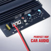A dark electronic module with controls and a red wire connected to it, used for car audio systems.