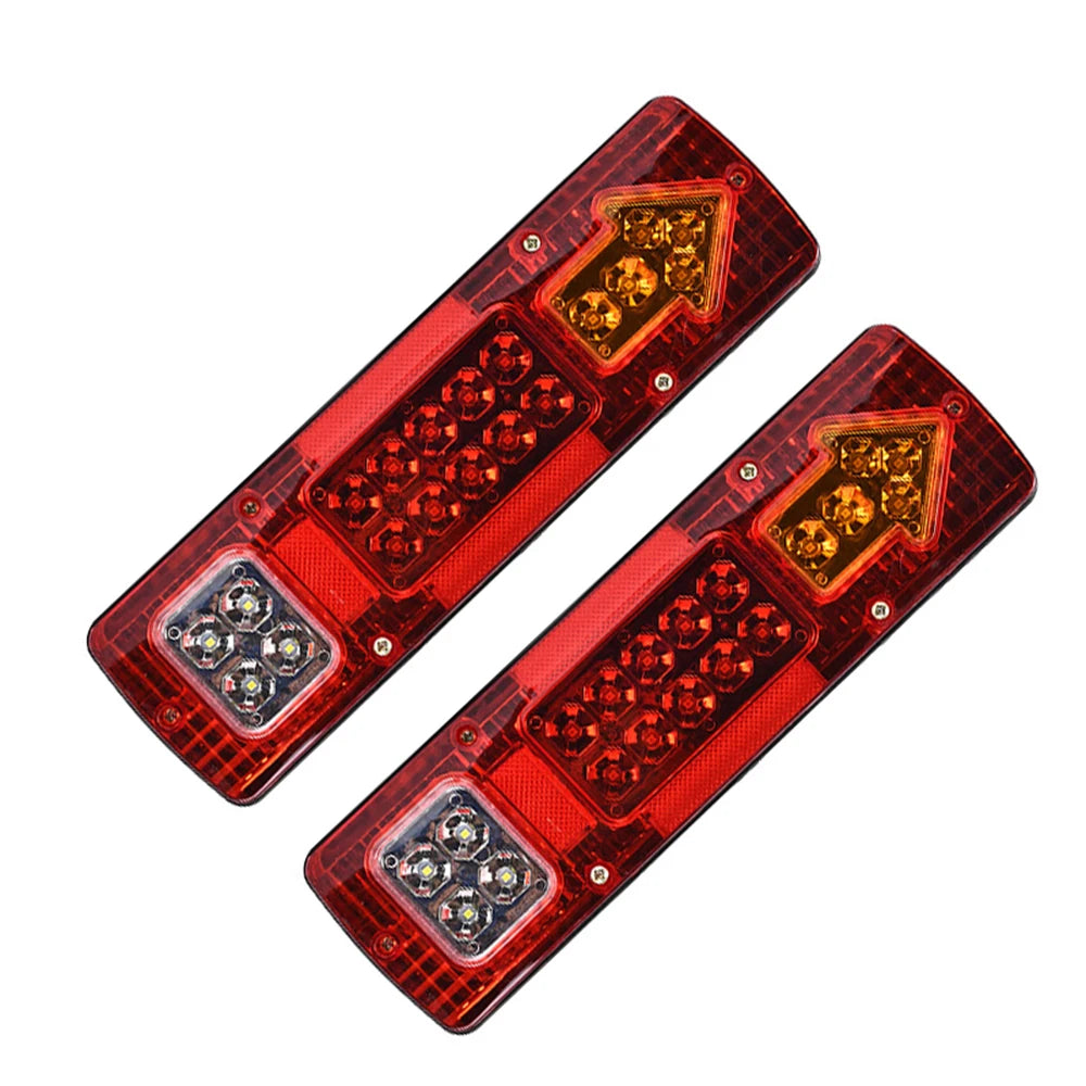 Dual high-brightness truck tail lights with amber turn signals mounted on a red plastic housing