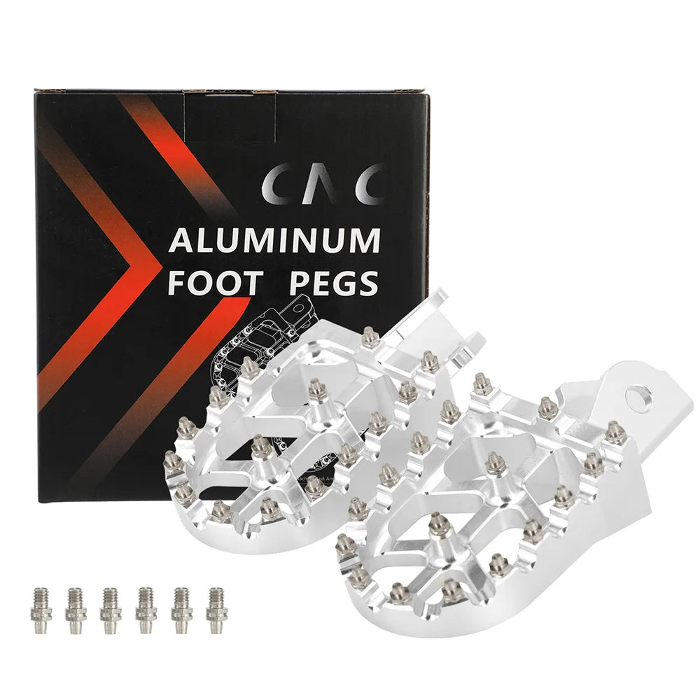 A box of aluminum foot pegs and several silver metal foot pegs are displayed.