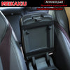 Black armrest pad cover for a car seat, shown in an installation instruction context.