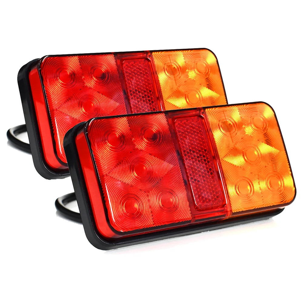 Dual high-brightness truck tail lights featuring red and amber lenses.